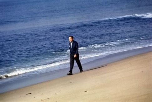 Richard Nixon strolling on the beach reposted by The Yale Record college humor magazine